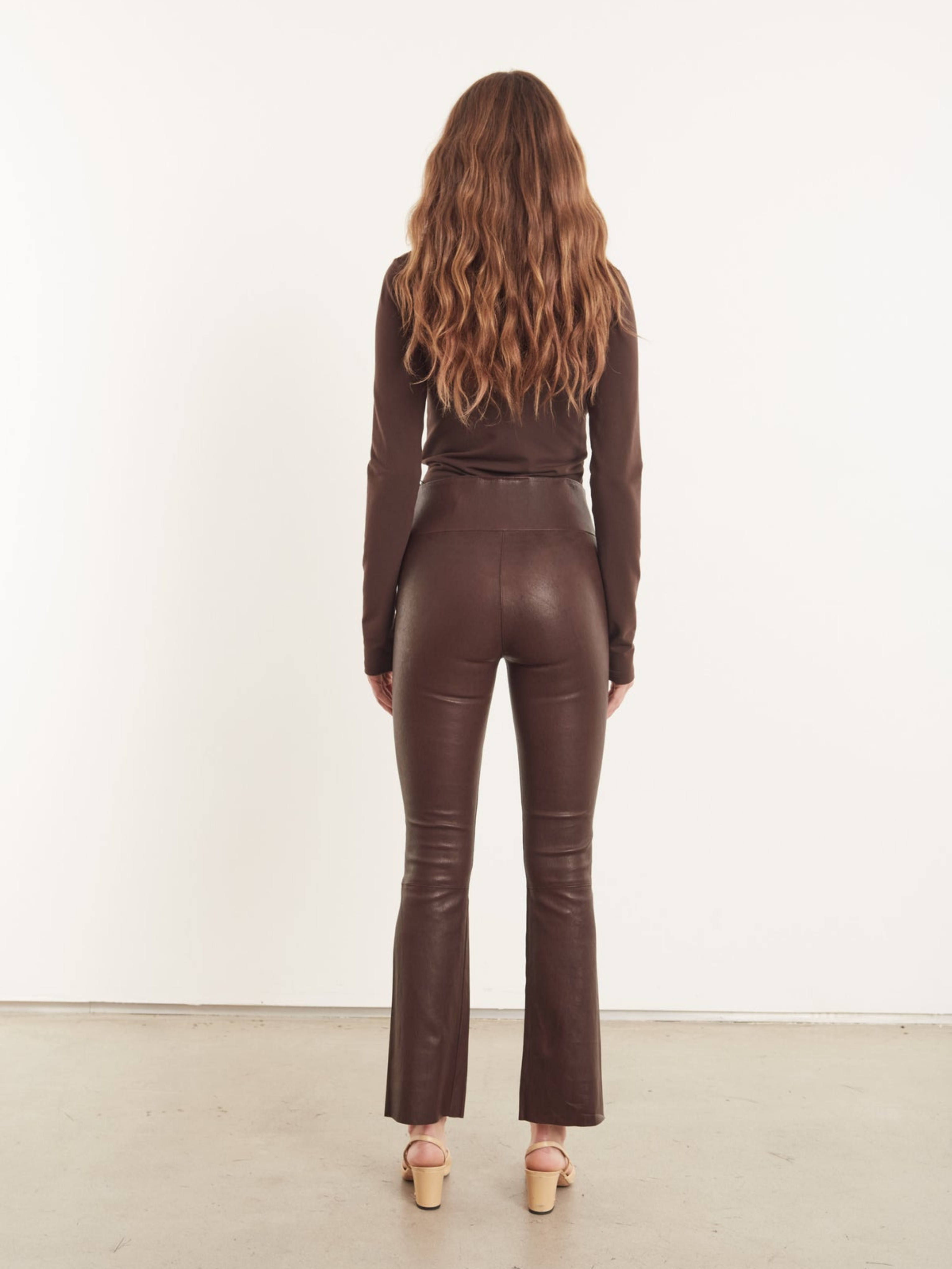 Faux stretch-leather flared pants